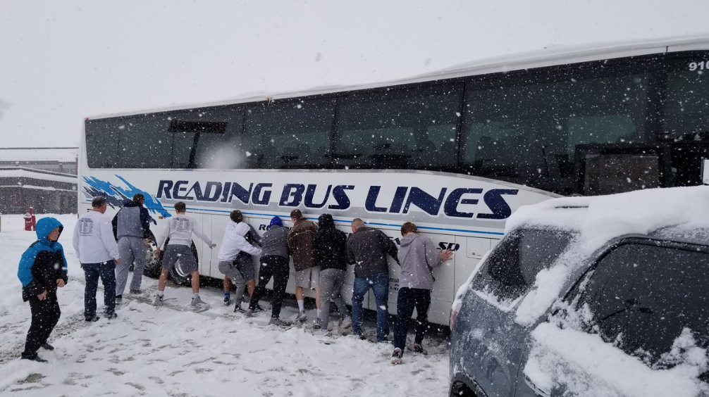 Dakota Valley basketball team pushing bus