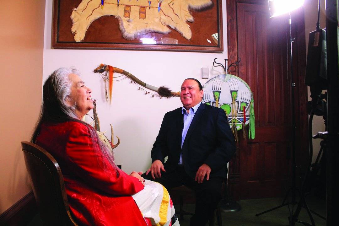 A. Gay Kingman and Richie Richards share a laugh on set.