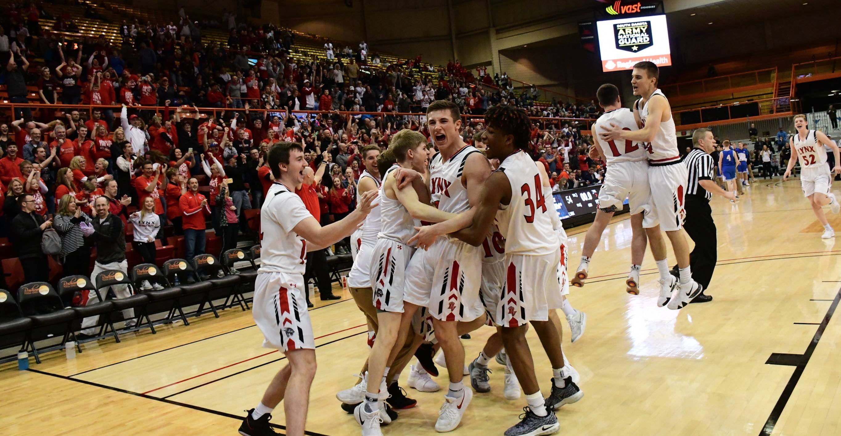 Boys basketball team celebrating