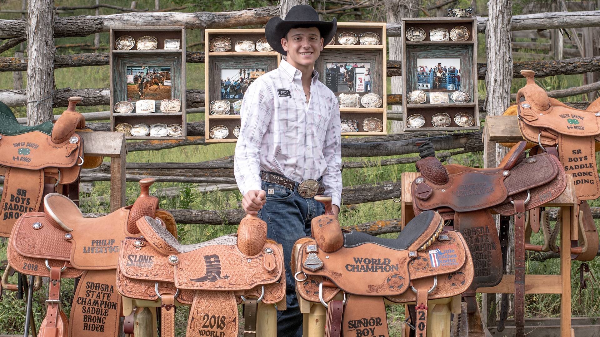 Cash Wilson with his saddles and buckles 