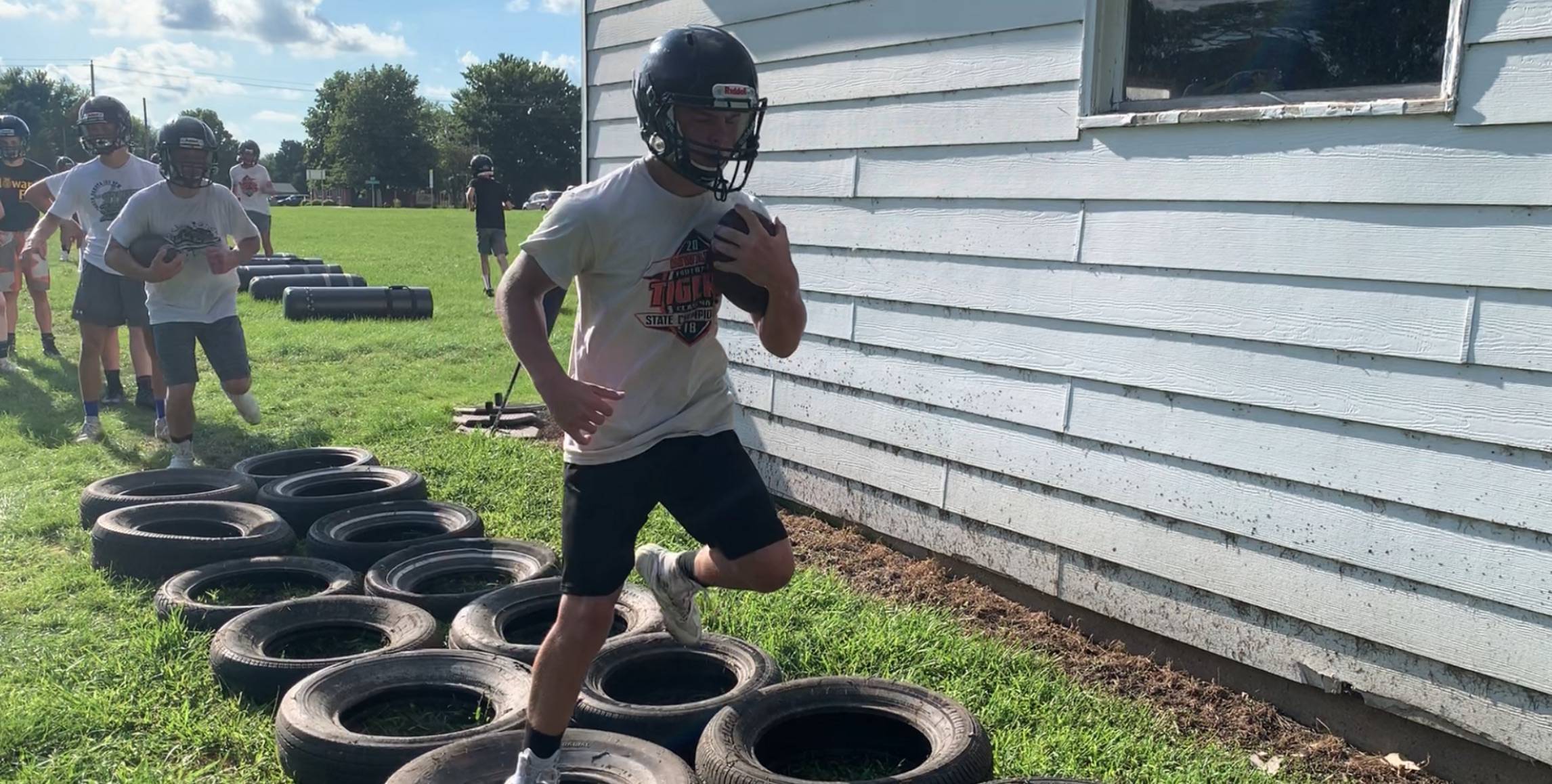 High school football players practicing 