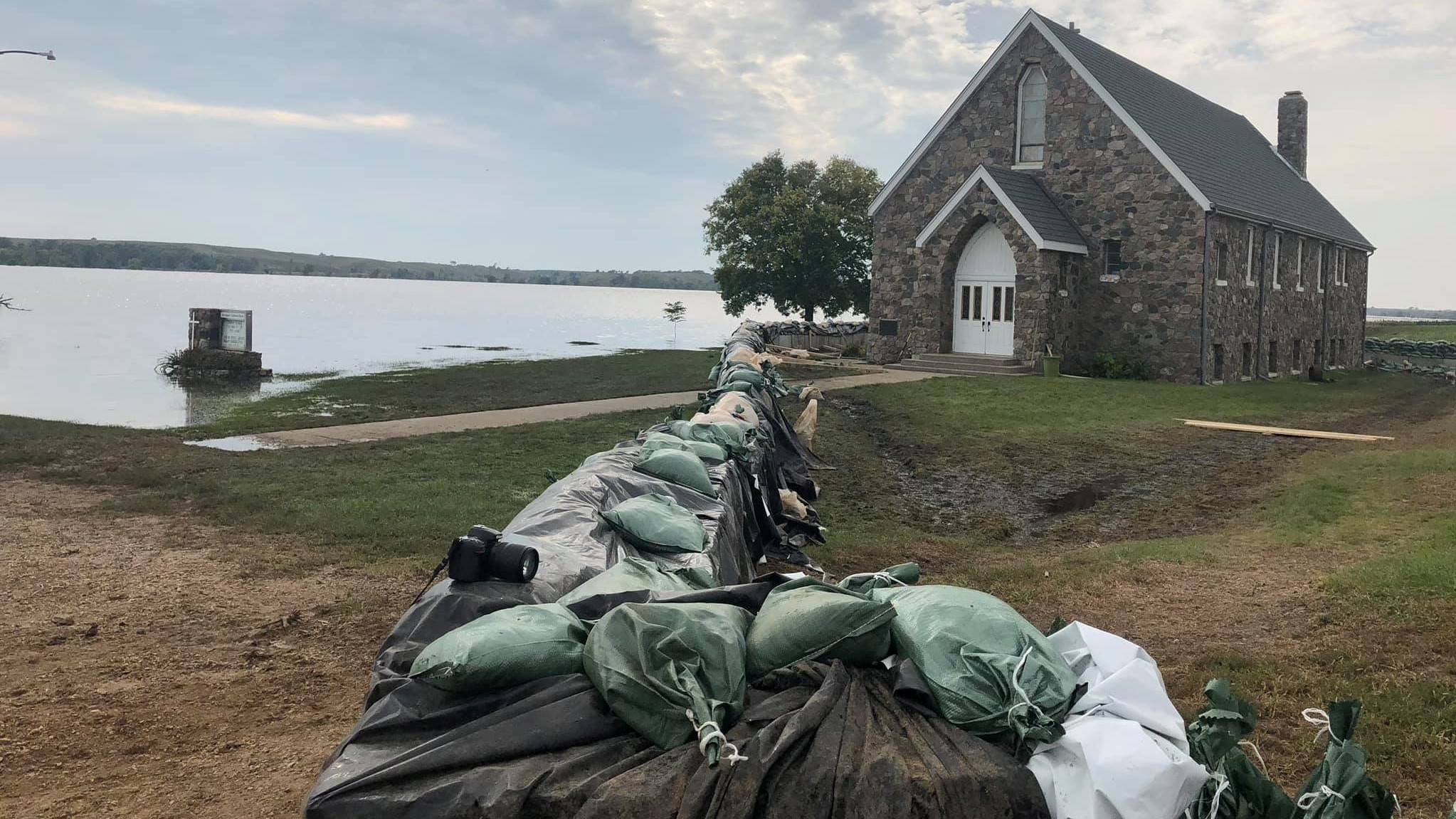 Sandbagging at historic stone church, Menno