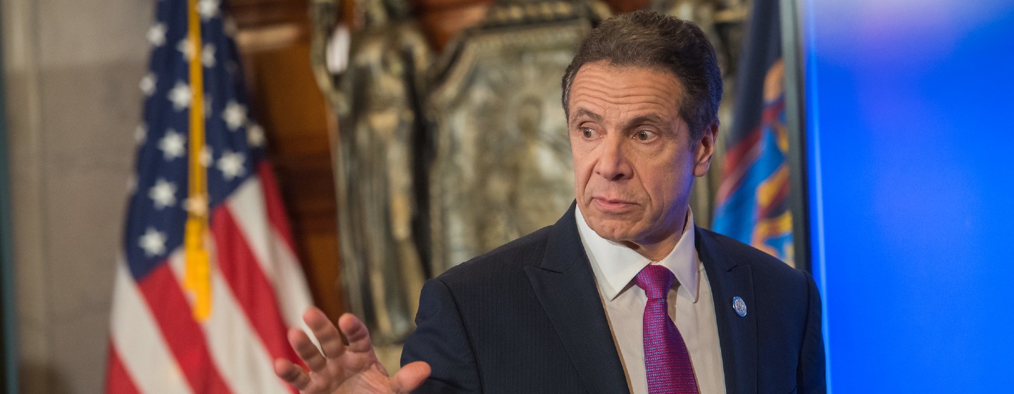 Governor Andrew Cuomo with his hand up