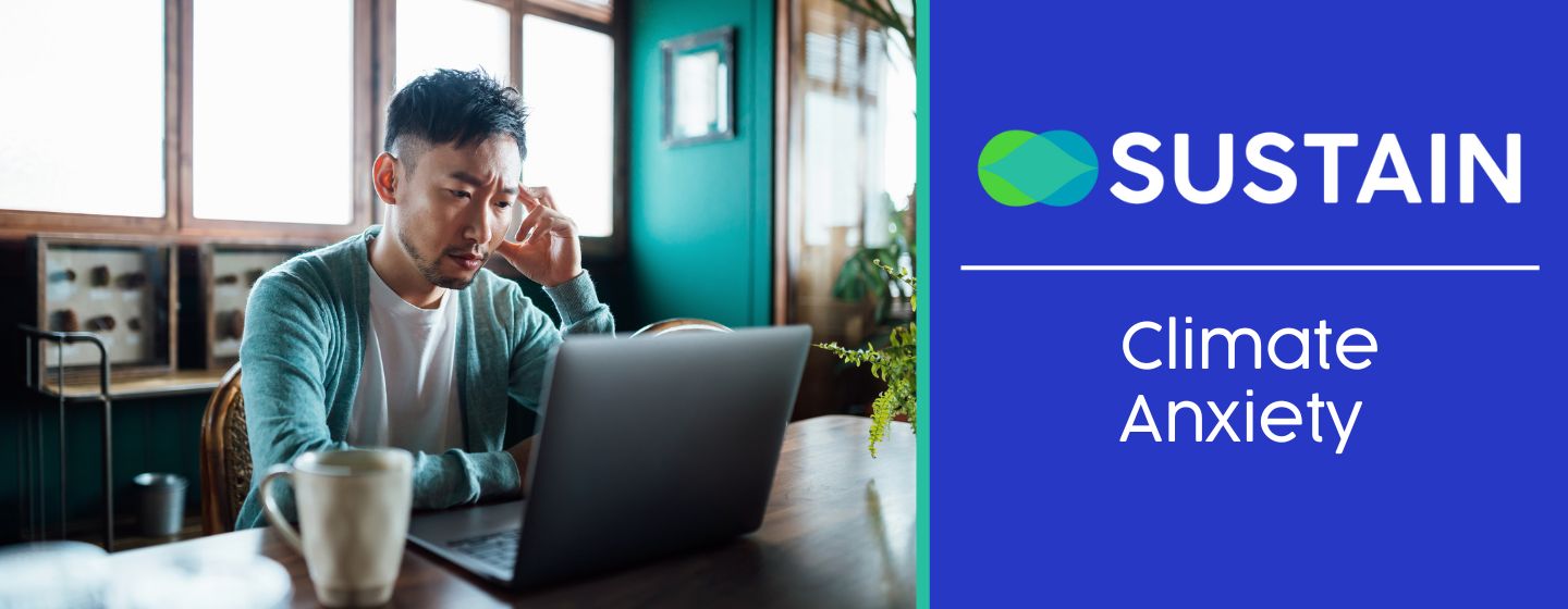 Man reading on a laptop looking anxious
