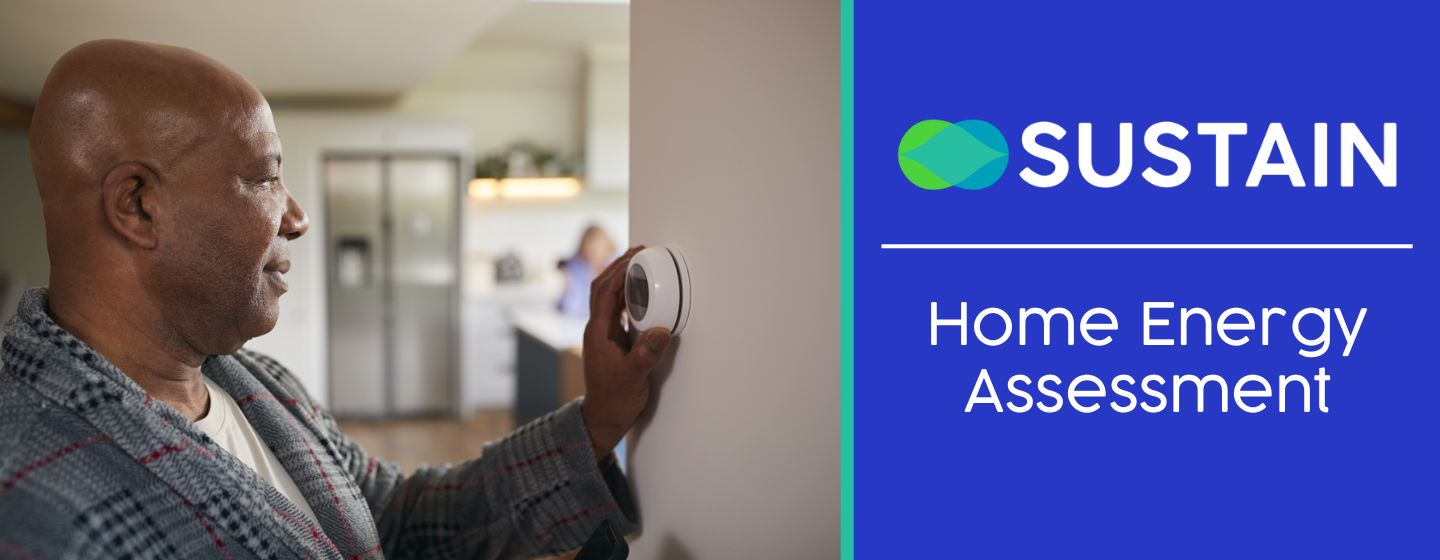 Man adjusting his thermostat