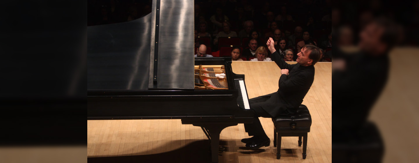 Pianist Stephen Hough playing at a concert.