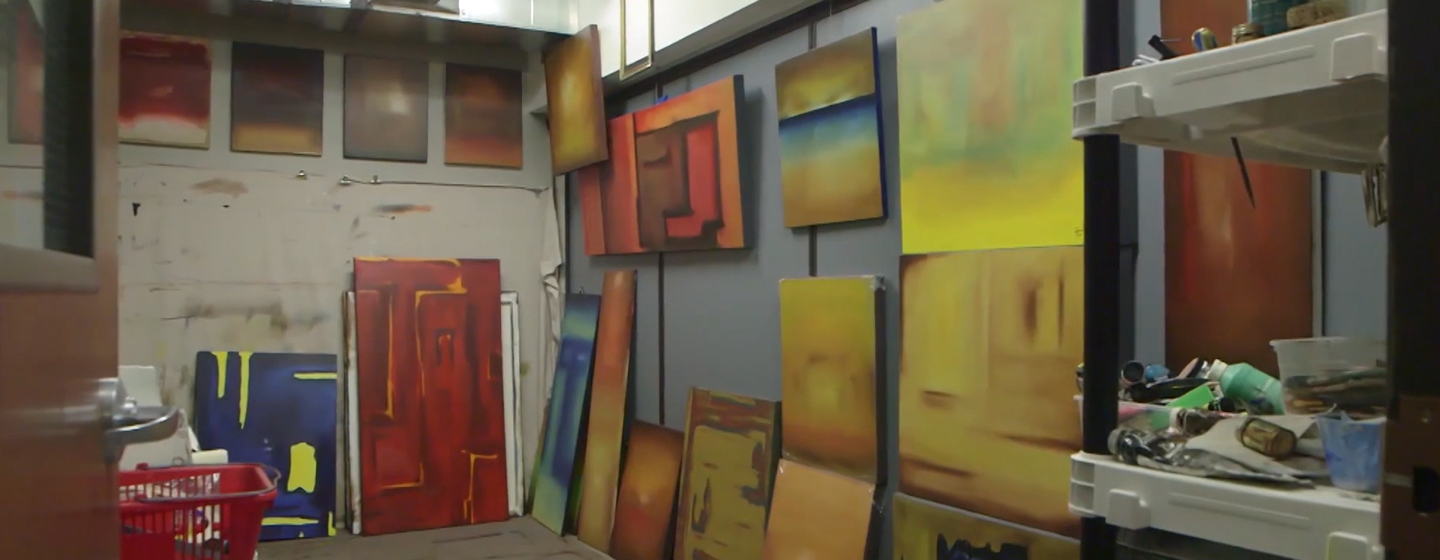 Painted canvases are seen hanging on the walls of the Albany Barn.