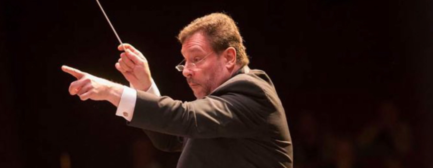 Schenectady Symphony Artistic Director Glen Cortese conducting an orchestra